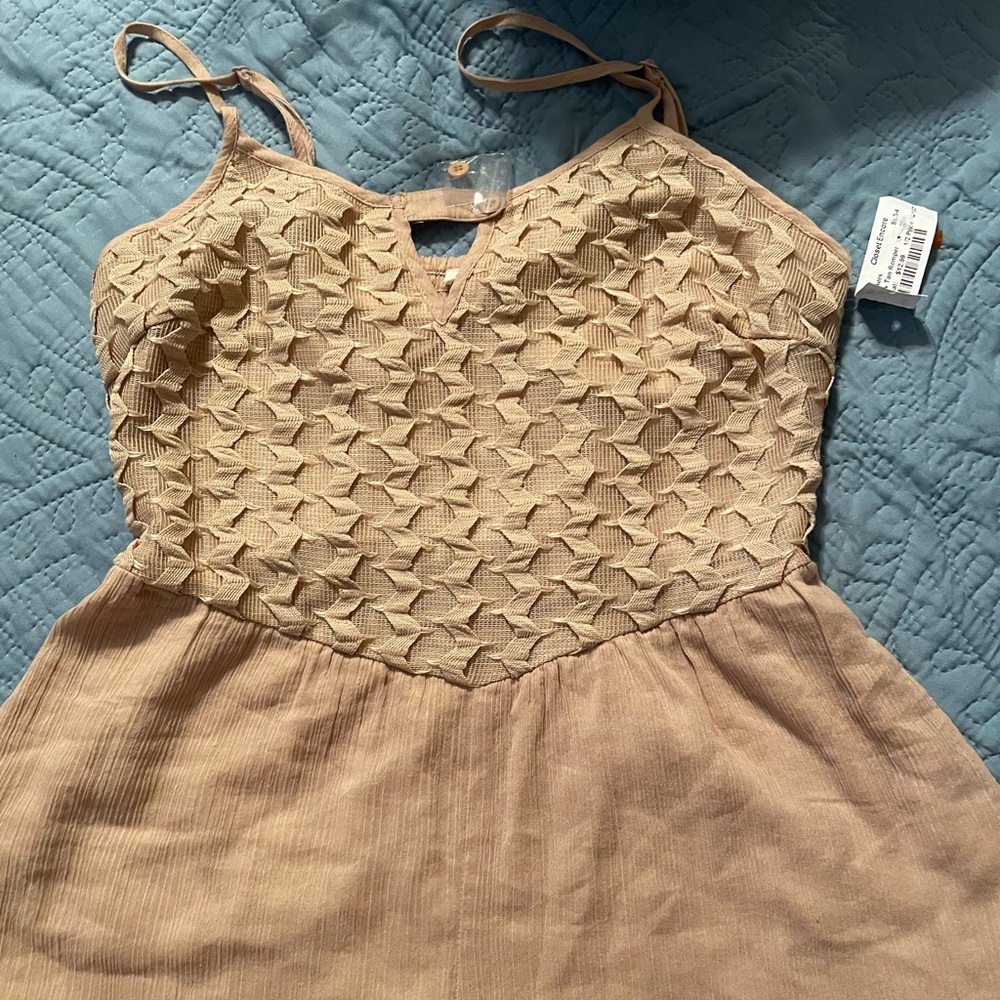 Taupe romper. Size small. Bought from That Cute Little Shop. Never worn.